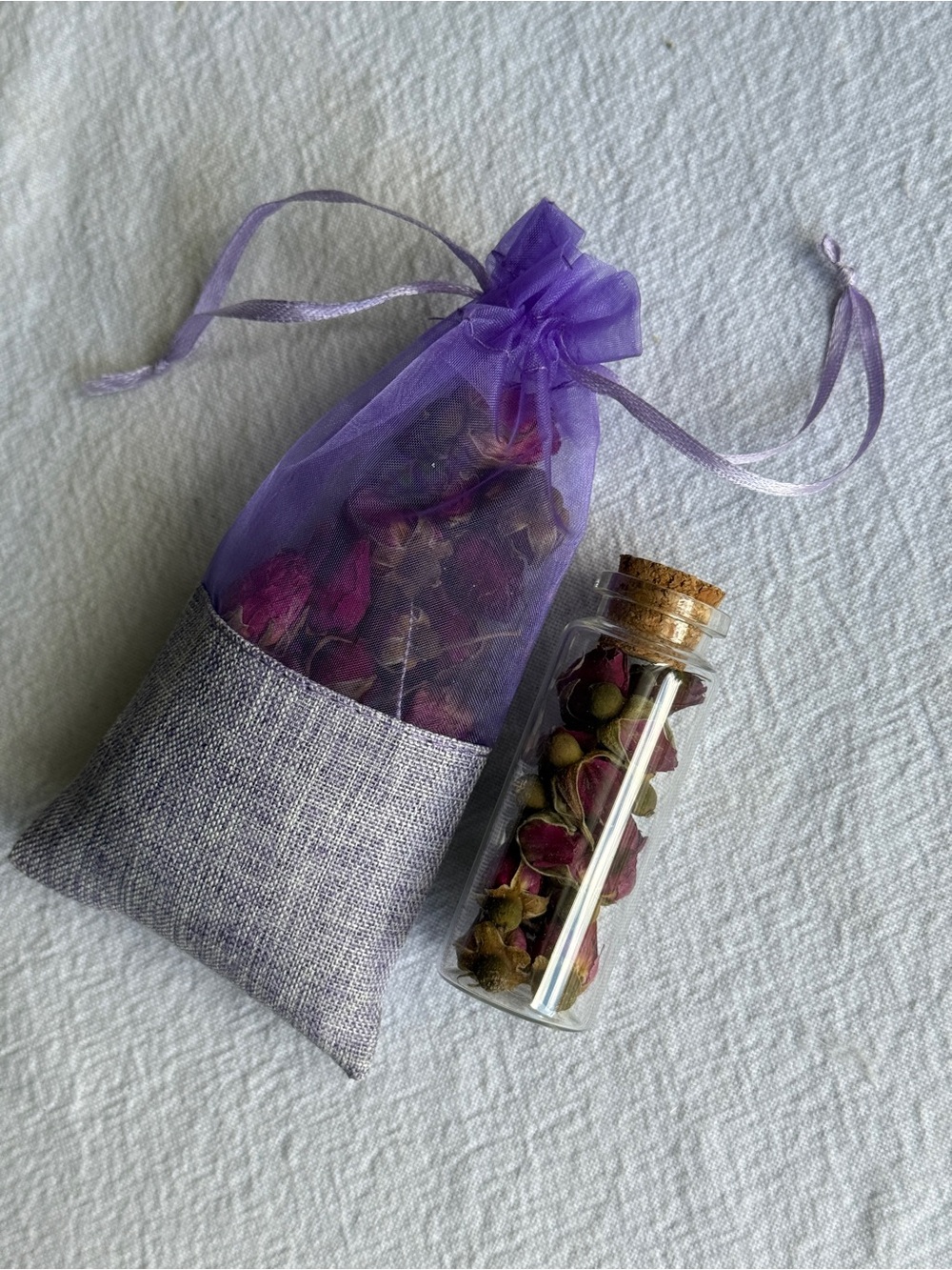 Purple Pouch and Mini Glass Vial of Rosebuds